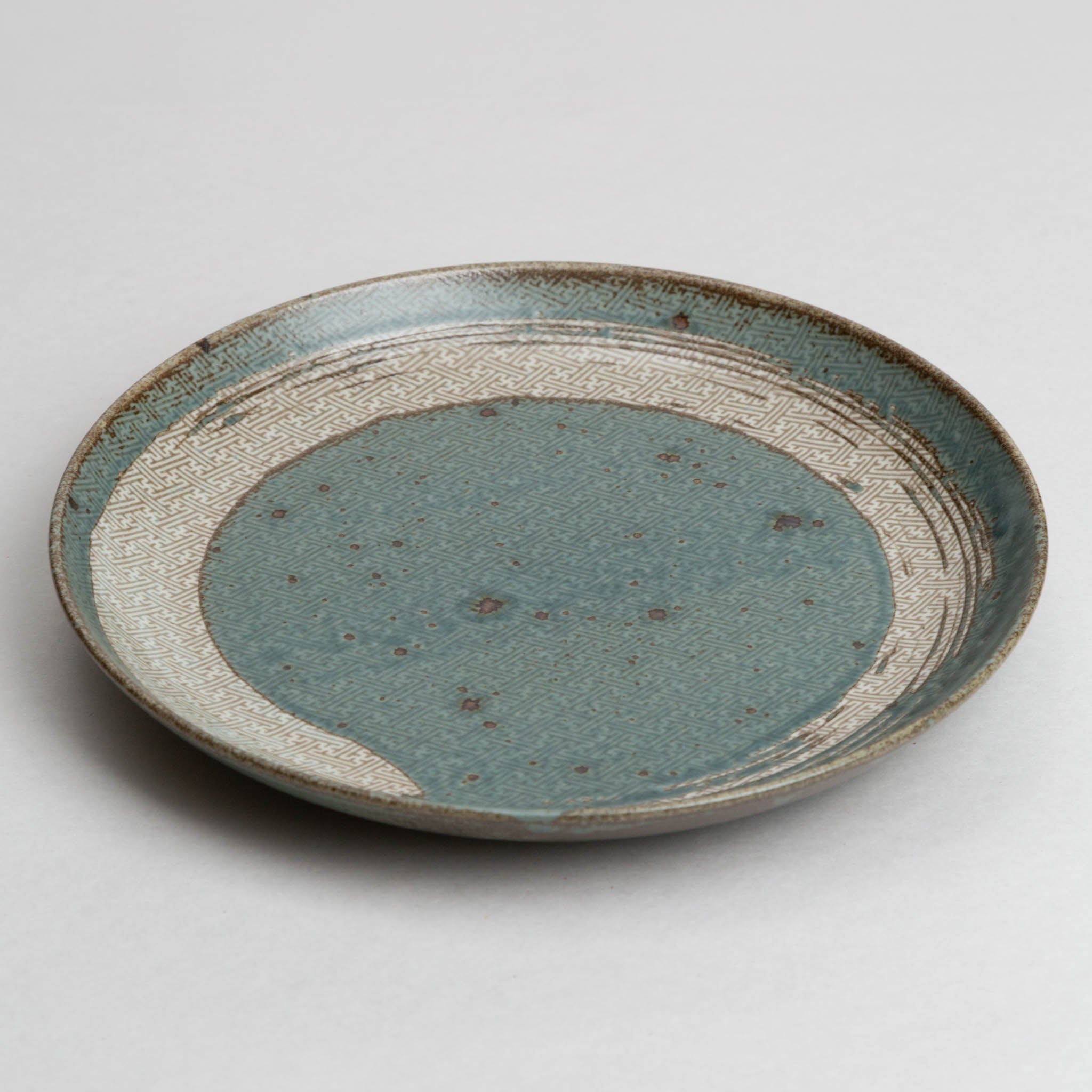 121-0456 Brush on pale blue plate