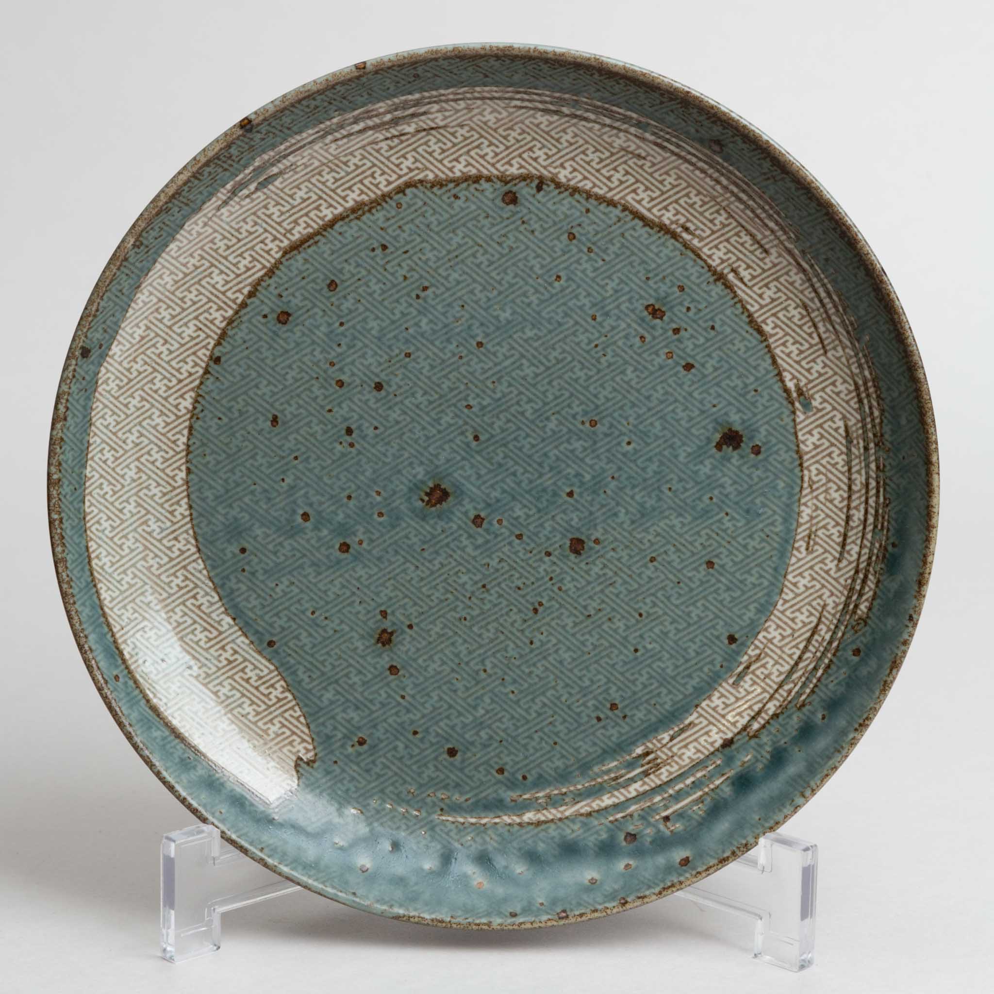 121-0456 Brush on pale blue plate