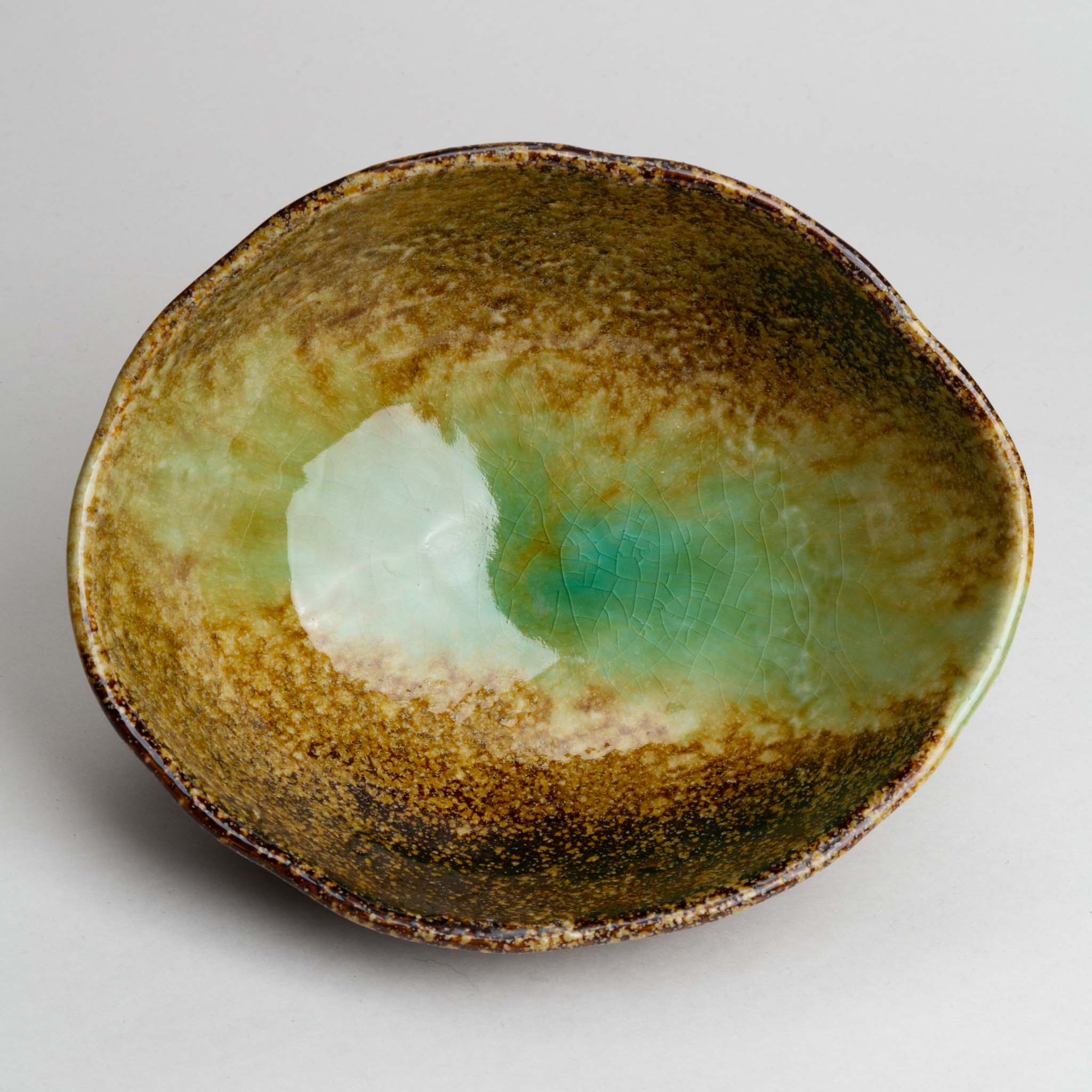 211-0145 Green on brown oval serving bowl
