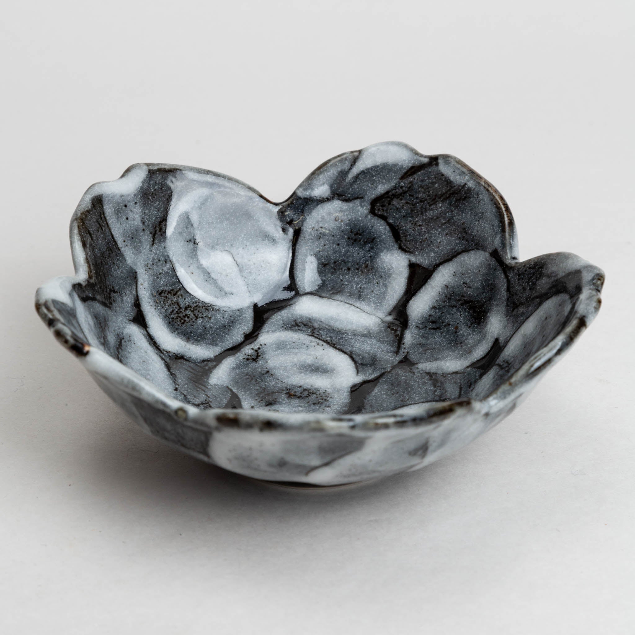 228-5857 Flower shaped white on black mid bowl