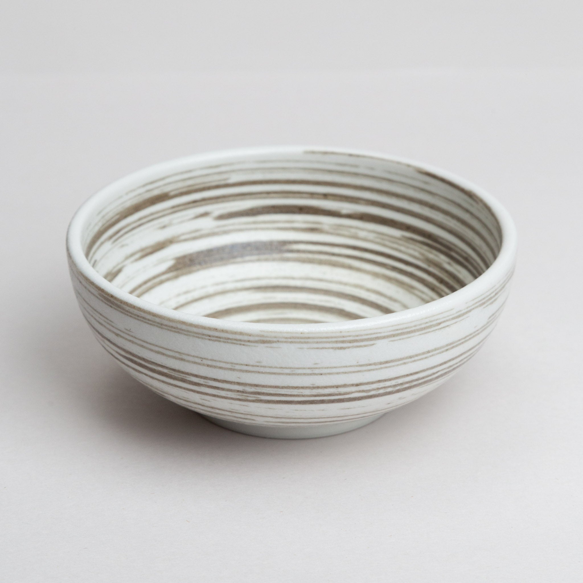 268-4106 Brown whirls on mat white small bowl