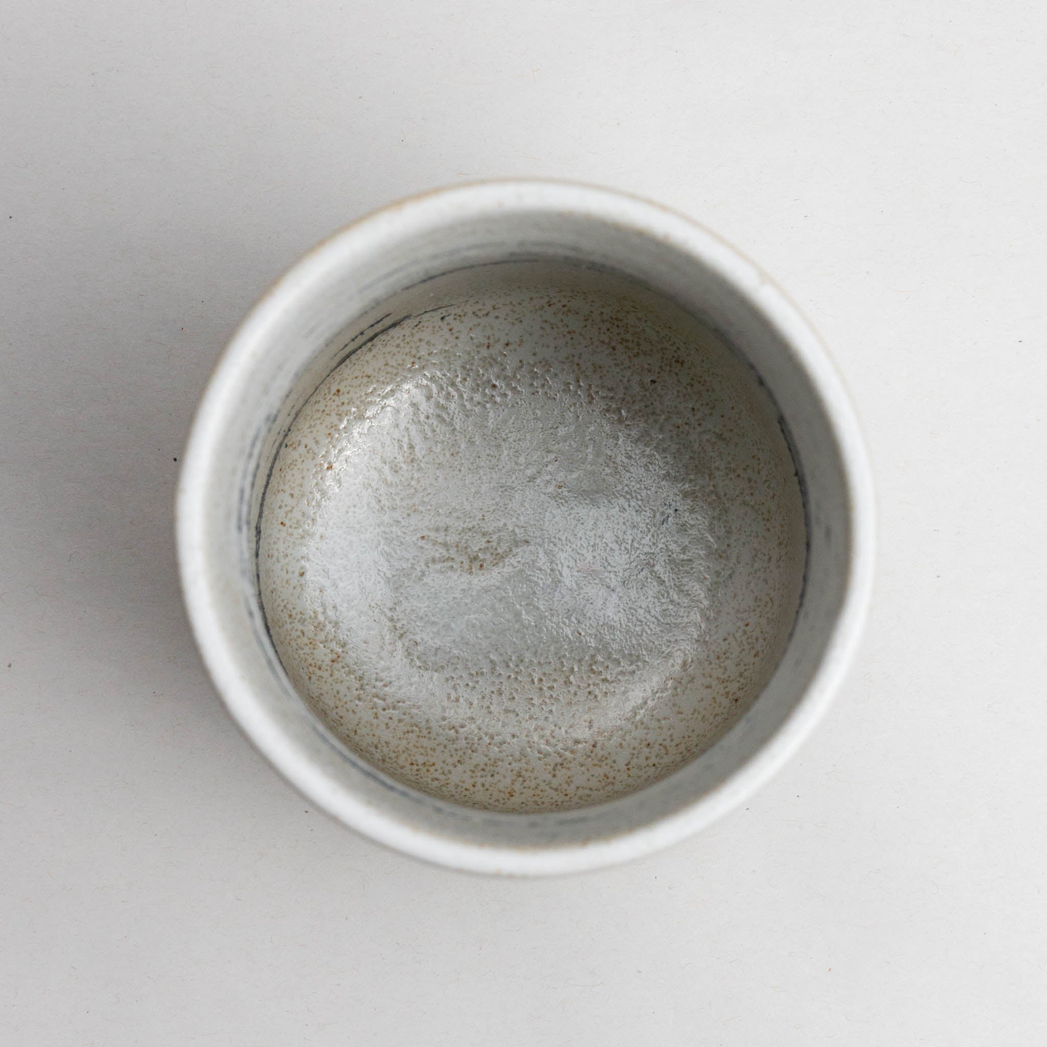 528-2271 Grey on white tea cup